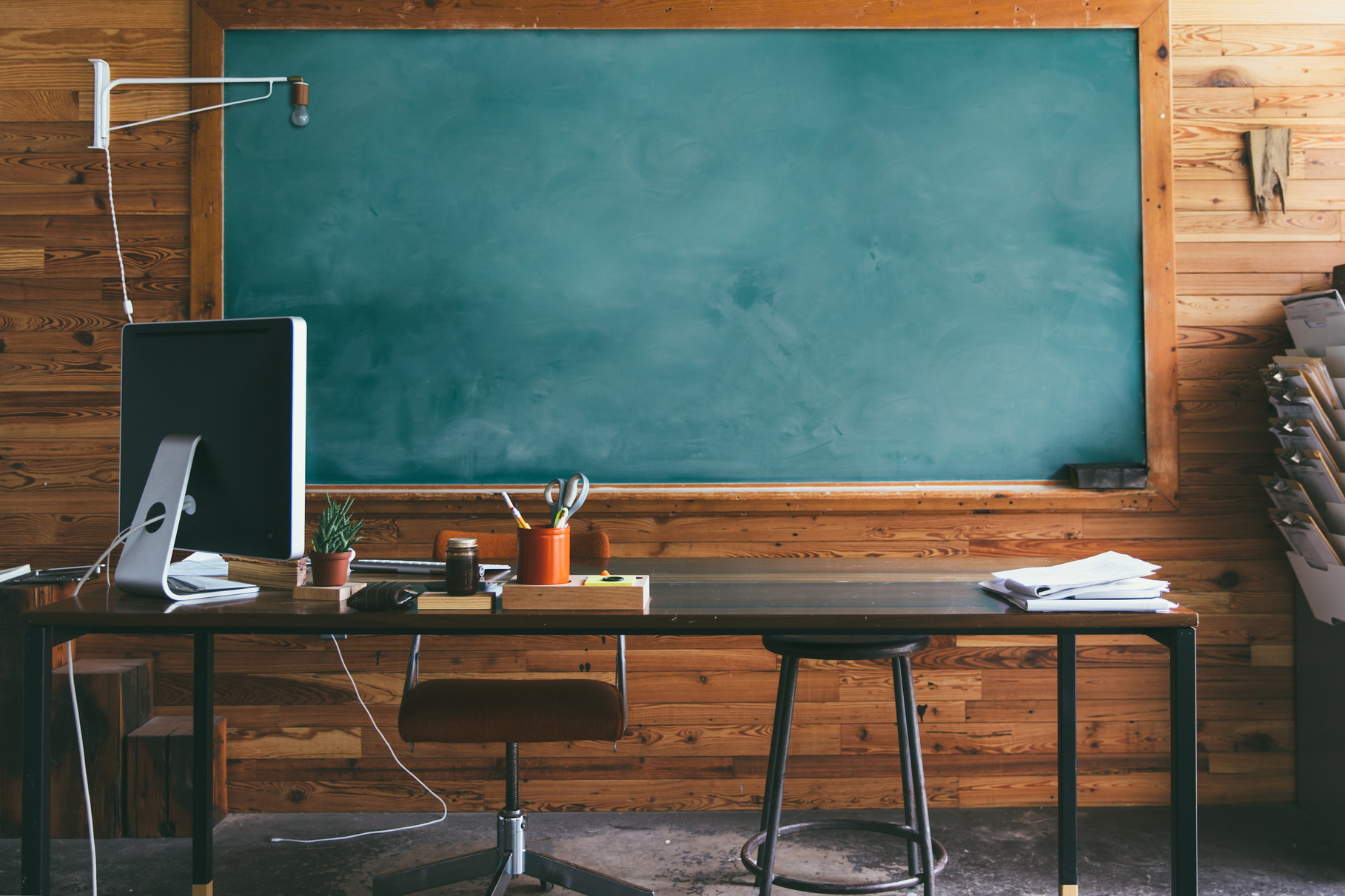 teacher's desk and chalkboard